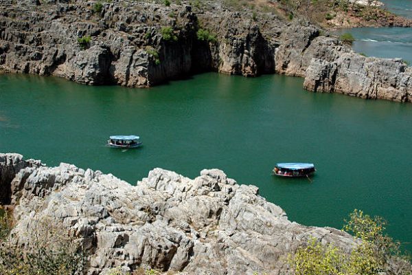 "Tourist boats in a serene, placid Narmada river at Jabalpur, Central India."